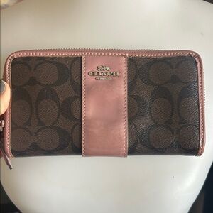 Coach Monogrammed long zip around wallet with purple patent leather trim